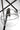 Lowing Grande Chandelier in Blackened Forged, first close view of a clear glass globe and its hammered arm