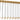 Lassell Short 27-Light linear chandelier by Sean Lavin in Natural Brass, three rows of crystal tubes hanging on black cords from a long brass canopy