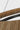 Noa Large Chandelier by Sean Lavin with a natural woven seagrass shade and Bronze finish, detail of the woven seagrass
