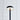 Flat disc head of the Black Moneta Medium floor lamp glowing against a tiled wall