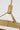 Sospeso X-Large Pendant by Sean Lavin in Natural Brass, close view of the housing where the stem meets the three straps, with the LED source below
