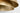 Shanti Grande Double Pendant by Sean Lavin in Natural Brass, view from below looking up into the upper shade, with the stem and the light source