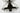 Shanti Grande Double Pendant by Sean Lavin in Polished Nickel, view from below looking up into the upper shade, with the stem and the light source