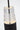 Lassell Short 1-Light Pendant by Sean Lavin in Nightshade Black, close view of the top of the crystal tube where the cord enters, with the LED glowing inside