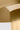 Close-up of the Hand-Rubbed Antique Brass Sesa Short Accent shade meeting the stem