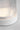 Detail of the Tawa Accent lamp's Matte White cap and ribbed glass