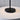 Nevis Short Accent table lamp in Black lit in a patio setting, close view