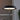 Close view of the lit disc shade on the black Tepa Short Accent table lamp