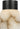 Caspe Alabaster 7 rechargeable lamp in Bronze with the dark cap on top of veined alabaster