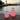 Vessel 2 and Vessel 2S Bluetooth LED Cordless Lamps by Smart & Green glowing pink and red on a waterfront dock at sunset - LoftModern