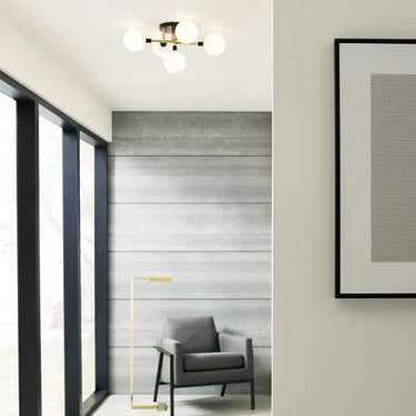 Visual Comfort Modern 5-light flush mount with opal glass globes for elegant residential or commercial decor