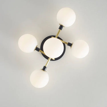 Sleek ceiling light with five opal glass bulbs, designed for modern interiors in homes, hotels, or offices