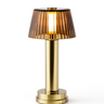Victoria cordless table lamp with amber glass shade, rechargeable ambient light for patio dining.