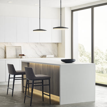 Warm 3000K LED light emitted from the Wyatt 16 inch round pendant.