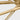 Modern geometric LED ceiling light, Cityscape Grande antique brass design, installed in a grand foyer, traditional home decor