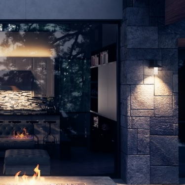 Charcoal Ash 8 outdoor wall light 700OWASHH by Visual Comfort illuminating a commercial building exterior.