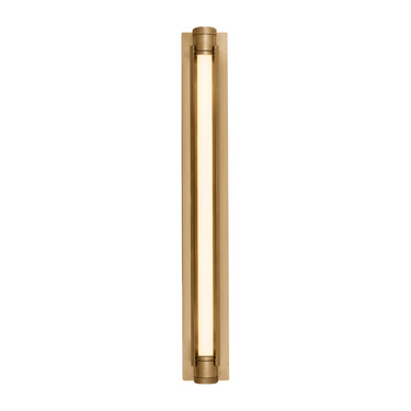 Modern LED bathroom wall sconce with warm dim light in upscale commercial restroom in brass finish