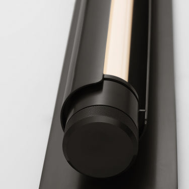Bronze Capa 36 inch LED vanity light with acrylic diffuser in contemporary powder room