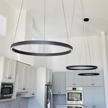 Visual Comfort Fiama 30-Inch Matte Black suspension fixture in luxury dining room
