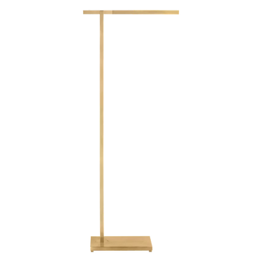 Stagger contemporary floor lamp in a natural brass finish, adding a sculptural accent to an office space.