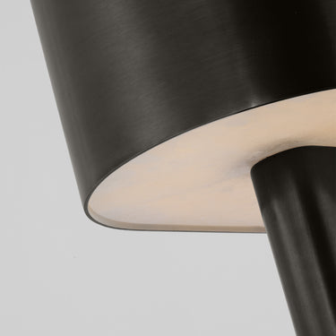 Compact 12-inch bronze accent lamp, structured and refined for contemporary living rooms.