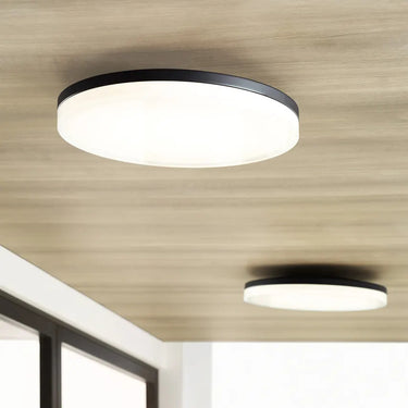 90 CRI 16 inch round flush mount light, installed in bedroom, highlighting accurate color rendering.
