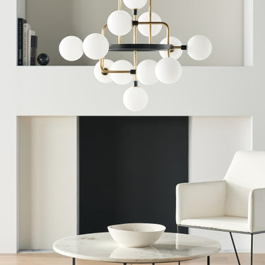 Viaggio chandelier in brass finish with opal glass, perfect for commercial lobbies or home entryways