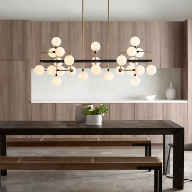 Contemporary 25-light chandelier with opal globes, brass arms, and sleek 56-inch linear profile