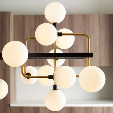 Elegant brass chandelier with frosted opal glass globes, 56-inch design for dining or living rooms