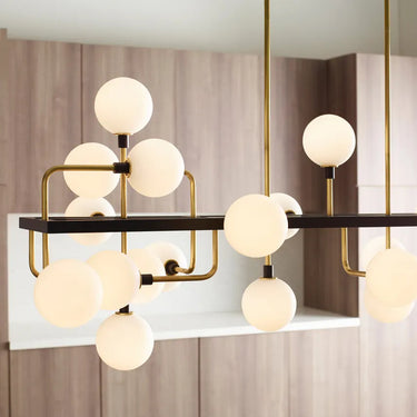 Visual Comfort style opal glass chandelier with brass frame, 56-inch length for modern interiors

