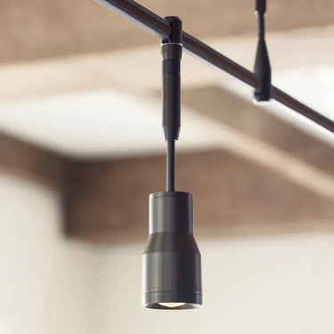 Close-up of adjustable LED spot head for directional task lighting in retail space