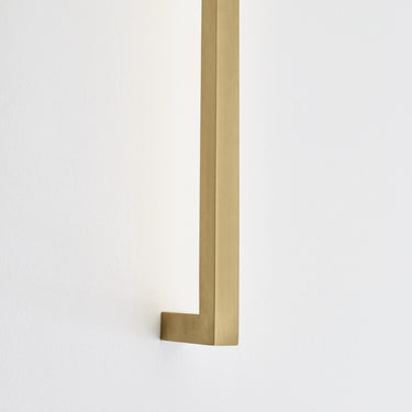 Contemporary LED wall light in natural brass for commercial lobbies, hotel corridors, and modern homes