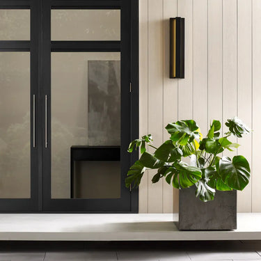 Black LED outdoor wall light with indirect illumination for residential patios and stairwells