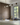 Wit modern linear fixture, 5 glass, showing the cylindrical glass and metal band design, kitchen island lighting.