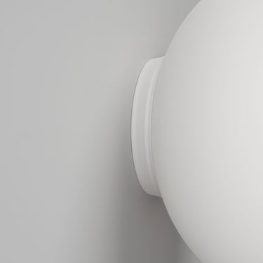 Volum Glossy White blown glass wall light by Lodes, round modern wall lamp for soft ambient lighting