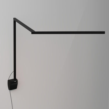 Slim adjustable LED wall light for bedside reading in matte black finish