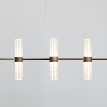 Modern office interior featuring the Artemide Zephyr modular chandelier with glare-controlled lighting