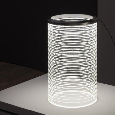 Designer table lamp by Artemide with polished aluminum ring and clear glass