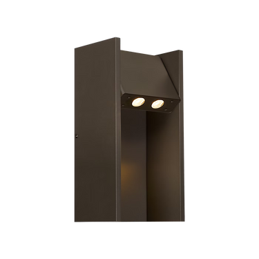 Warm bronze Zuri exterior wall light mounted beside a modern front door with architectural styling