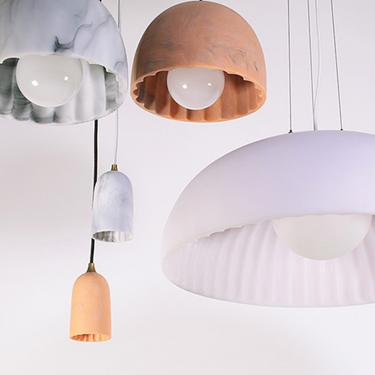 Elegant resin ceiling light, Doric 8, providing soft diffused illumination.