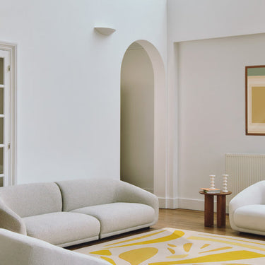 Alpha wool rug in Yellow, styled in a room