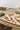 Alpha wool rug in Terracotta, styled in a room