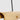 Close-up of Ambrose 72 linear chandelier's solid brass frame and integrated LED strip for energy efficiency. 