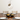 Artemide Miconos Gold pendant light with clear glass globe installed on top of a dining table