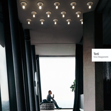 White Artemide Teti ceiling light with exposed bulb