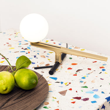 Artemide Yanzi Table Lamp with brushed brass bird and opal glass