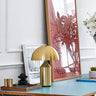 Designer table lamp Atollo Gold by Vico Magistretti in living room
