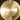 Close-up of the brass disc and smoked glass shade of the Pendulum pendant light