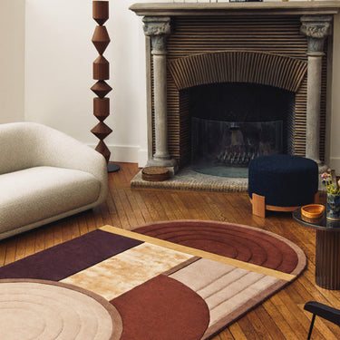 Bijoux Précieux wool rug in Brown, styled in a room