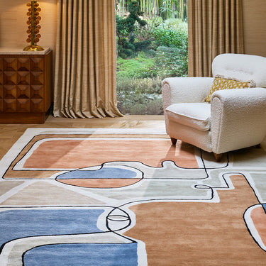 Bleu des Yeux wool rug in Multi, styled in a room